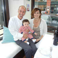 <p>Pasquale De Martino and Jennifer Galletti, owners of Trattoria &#x27;A Vucchella, with their son, Michele.</p>
