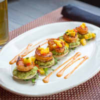 <p>Srirachi-seared Gulf shrimp is one of the fusion-style dishes served at The Hudson Room.</p>