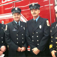 <p>Wilton Fire Department firefighters from left, Brian Elliott, Kevin Plank, Ralph Nathanson and Deputy Chief AMark Amatrudo, Ralph Nathanson, stand in front of Engine 4, the new addition to the department&#x27;s fleet, following a ceremony Wednesday.</p>