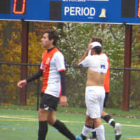 <p>With about 22 minutes left in regulation play, a Port Chester player expressed his frustration after kicking the ball just over the net by pulling his shirt over his head.</p>