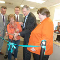 <p>Stamford resident Mirella Liotta, center, helps cut the ribbon at the new DMV office in Stamford on Thursday. From left state Sen. Carlo Leone, state Rep. Gerald Fox, Mayor David Martin and DMV Commissioner Melody A. Currey.</p>