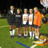 <p>The Mamaroneck senior captains with their team mascot after Thursday&#x27;s quarterfinal win.</p>