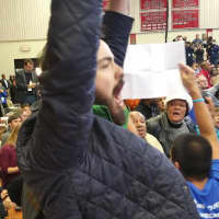 <p>A protester holds up a sign and interrupts the speech by President Barack Obama. </p>