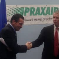 <p>Gov. Dannel Malloy and Chairman and CEO Steve Angel celebrate the deal between the state and Praxair. </p>