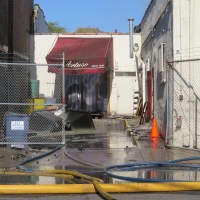 <p>Water could be seen pouring out of several doors at Artuso&#x27;s Pastry Shop in Mount Vernon.</p>