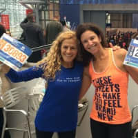 <p>Lauren Field and Beth Segaloff of Fairfield show off their numbers prior to the TCS New York City Marathon.</p>