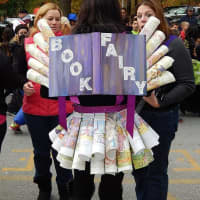 <p>A girl is dressed as a book fairy for the parade. </p>