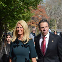 <p>Gov. Andrew Cuomo (right) arrives to his polling place in New Castle with his partner, Sandra Lee (left).</p>