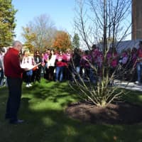 <p>Sacred Heart University Chaplain the Rev. David Buckles, left, speaks during a special tree dedication ceremony in honor of Kaitlyn Doorhy on Oct. 25, just outside of the Chapel of the Holy Spirit on campus in Fairfield.</p>