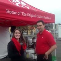 <p>Erica Wedgwood of West Virginia and Mike Thornton from Louisiana are part of the Chick-Fil-A crew who came to Danbury to help open the new restaurant - and to run a game of musical chairs in the parking lot. </p>