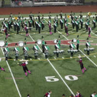 <p>The Marching Bears of Norwalk High School play on the field at Kennedy Stadium.</p>
