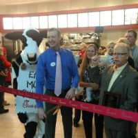 <p>Rich Beattie, owner/operator of the new Chick-fil-A at the Danbury Fair Mall, holds a ribbon-cutting ceremony flanked by Mayor Mark Boughton and the fast-food restaurant&#x27;s mascot cow. </p>