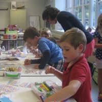 <p>Royle students organize supplies and make bookmarks as part of the Back to School supply drive to benefit foster care children in Bridgeport.</p>