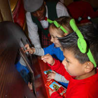 <p>Preschoolers from the Boys &amp; Girls Club of Northern Westchester design their own sleigh at The North Pole Adventure. </p>