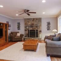 <p>A beautiful stone fireplace is included in the family room at the home in Carmel.</p>