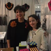 <p>Studio DGM creator Danielle Gori-Montanelli poses with her business partner, and daughter, Saskia Gori-Montanelli, at CraftWestport on Saturday at Staples High School.</p>