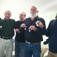 <p>Vincent Meli, 92, of Greenwich holds up a medal for his World War II service. From left U.S. Sen. Richard Blumenthal, Meli, his son Charles, his son Vincent Jr., and his grandson Alexander. Meli was handed his medals Monday.</p>