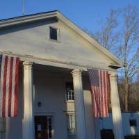 <p>North Salem&#x27;s annex building, near Town Hall, is adorned with a pair of American flags. </p>
