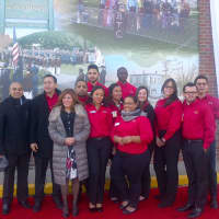<p>Members of the Wells Fargo team in front of the Eastchester historical mural.</p>