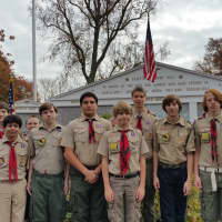 <p>Members of Fairfield&#x27;s oldest Boy Scout Troop (10) help set up at the Wall of Honor for Tuesday&#x27;s ceremony. It is the fourth time in as many years that the 102-year-old troop has helped the town celebrate the day.</p>