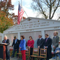 <p>First Selectman Michael Tetreau reads his speech on Veterans Day, Nov. 11.</p>