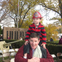 <p>Declan Farrell of Silver Lake and his son, Dillon, who turns 3 in January, enjoyed the Harrison Veterans Parade.</p>