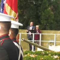 <p>Harrison Police Chief Anthony Marraccini spoke about the patriotic veterans in the crowd as Marines stood nearby.</p>