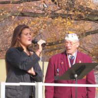 <p>Soloist Kelly Curtis was joined in &quot;God Bless America,&#x27;&#x27; by Veterans Service Officer Ben DeFonce and most of the West Harrison audience.</p>
