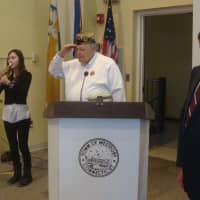 <p>William Vornkahl and Jim Marpe stand at attention while Emily Burke plays &quot;Taps&quot; during Westport&#x27;s Veterans Day ceremony.</p>