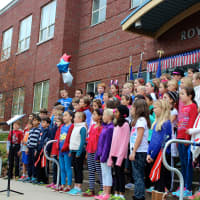 <p>The Royle School Chorus performing the National Anthem.</p>