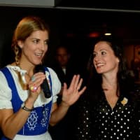 <p>Event chairmen Erin McCall and Melissa Levin thank the big crowd at Oktoberfest.</p>