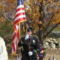 <p>The Weston Police Department color guard presents the United States flag.</p>