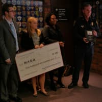 <p>Lt. Thomas Mrozek and Fairfield University&#x27;s Beach Residents Advocacy Group were presented plaques for their service work by the Executive Director of Mothers Against Drunk Driving, Janice Heggie Margolis.</p>