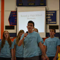 <p>Members of Greeley student musical group The Enchords give a performance at the spelling bee.</p>