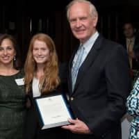 <p>Rick Dickson, left, Robert Cummings of Dunbar Educational Consultants, center, are congratulated by Sarah Reingold, center, and presented by Shirley Acevedo Buontempo and Connie Grossman, right, president of Latino U&#x27;s board.</p>