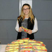 <p>Rebecca Sklar, 13, of Scarsdale serves as a teen volunteer helping the younger kids fill bags. 
</p>