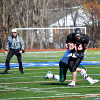 <p>Rye quarterback Andrew Livingston gains ground in the Garnets&#x27; 21-17 loss to Section 2&#x27;s Cornwall in the New York Class A quarterfinals at Mahopac High School on Saturday.</p>