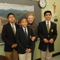 <p>Ann Mara with San Miguel Academy of Newburgh students Brandon Miller, Nas;ah Dabbs, and Daniel Ruiz in front of the San Miguel student student creed &quot;I Will Not Quit&quot;
</p>