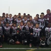 <p>The Fairfield Giants Pee Wee team celebrates after beating New Fairfield, 19-0, for the state Pop Warner championship.</p>