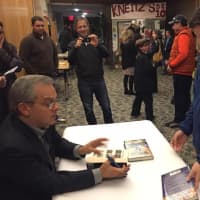 <p>Tommy Wiesenberg of Larchmont meets renowned sports writer Mike Lupica Sunday following a community program called Harvey Presents: Mike Lupica in The Walker Center for the Arts in Katonah.</p>