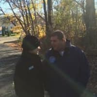 <p>Jocelyn Keith of Habitat for Humanity talks with Chris Rosario, director of the citys Anti-Blight and Illegal Dumping Department, as the house is demolished.</p>