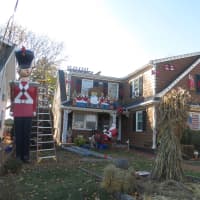 <p>A Harrison homeowner at the corner of Parsons Street and Oakland Avenue took advantage of milder temperatures Thursday, Nov. 20, to put up his annual Christmas decorations.</p>