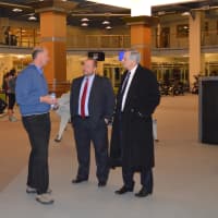 <p>David Tewksbury, left, talks with Thomas Madden, center, and Stamford Mayor David Martin.</p>