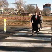 <p>It wasn&#x27;t quite Abbey Road, but Mayor David Martin, along with Operations manager Ernie Orgera, Board of Representatives District 9 member Rodney Pratt and Public Safety Director Ted Jankowski walk in a crosswalk beside a new stanchion, at left.</p>