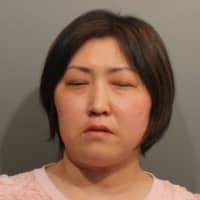 <p>Yuxin Zeng, 44, of Fresh Meadows, N.Y., is charged with third-degree promoting prostitution and employing an unlicensed massage therapist at Green Tea Spa located at 7 Danbury Road. </p>