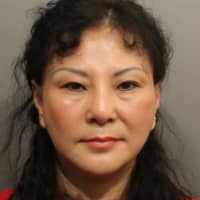<p>Hui Min Lu, 53, of Flushing, N.Y., is charged with prostitution and practicing massage therapy without a license. Polices</p>