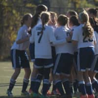 <p>Wilton girls celebrate a goal during a game this season. The team went 8-1-2 and earned a share of the league title.</p>