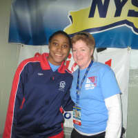 <p>Nicole Parry with Mamaroneck swim coach Cathleen Ferguson after her relay race and before her individual sprint races.</p>