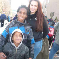 <p>Ashley Telesco, of Stamford, with her godchildren brothers Drevon, 9, and Matthew Kearney, 5, at the parade.</p>