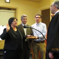 <p>Eastchester Trustee Theresa Nicholson being sworn in by former Trustee Fred Salanitro.</p>